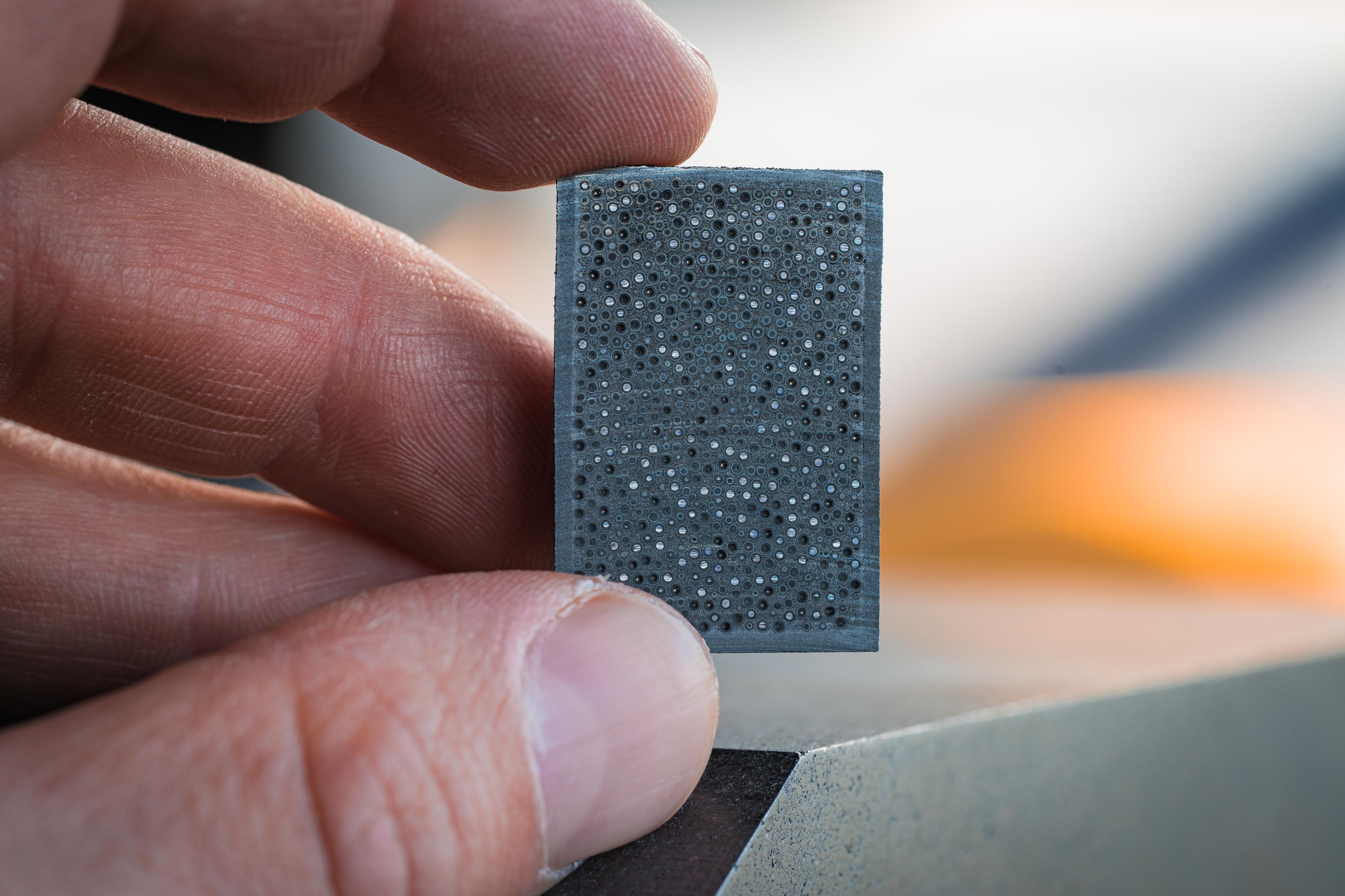 Inside every TRISO compact: a kernel of fissile material wrapped in multiple ceramic layers, plus matrix graphite that provides structural strength but zero reactivity.